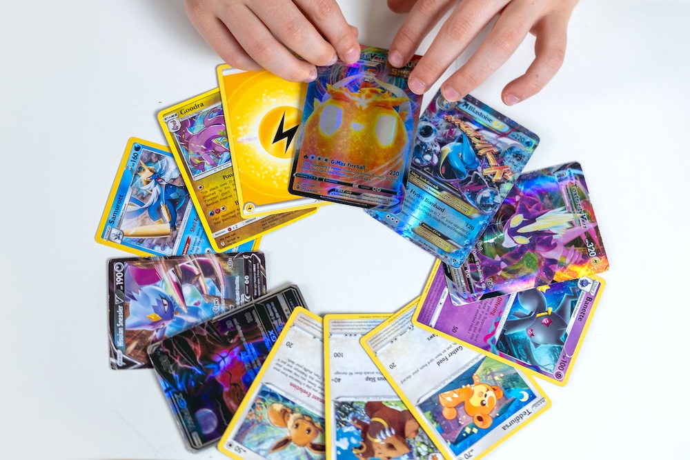 boy playing Pokemon Trading Cards,